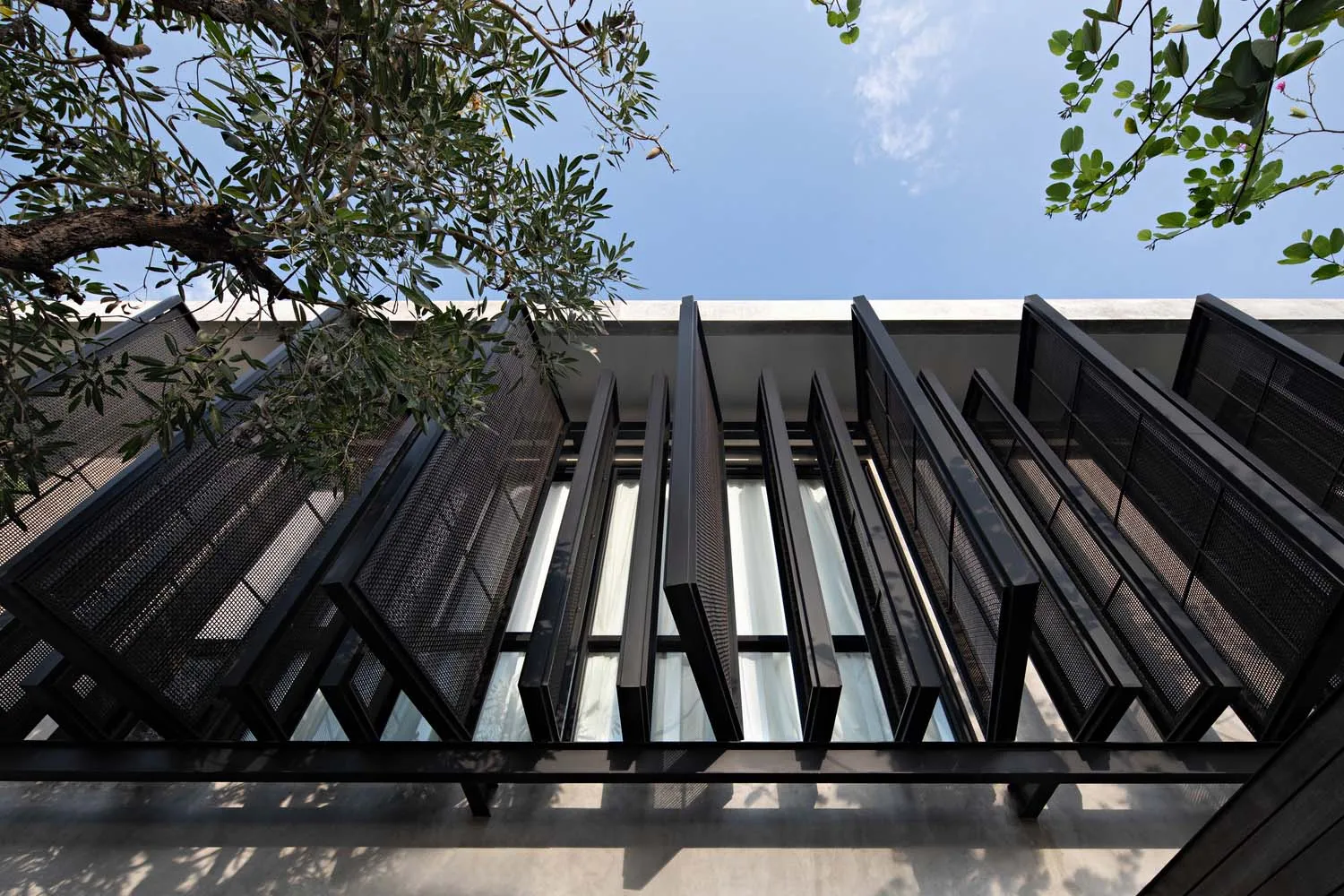 Modern building exterior featuring black metallic structural elements