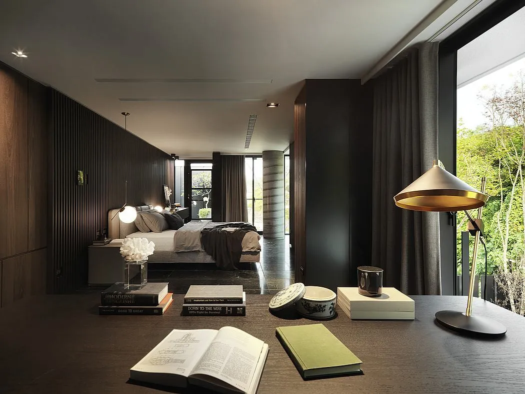 A modern bedroom featuring dark wood, fabric upholstery, and a glass window.