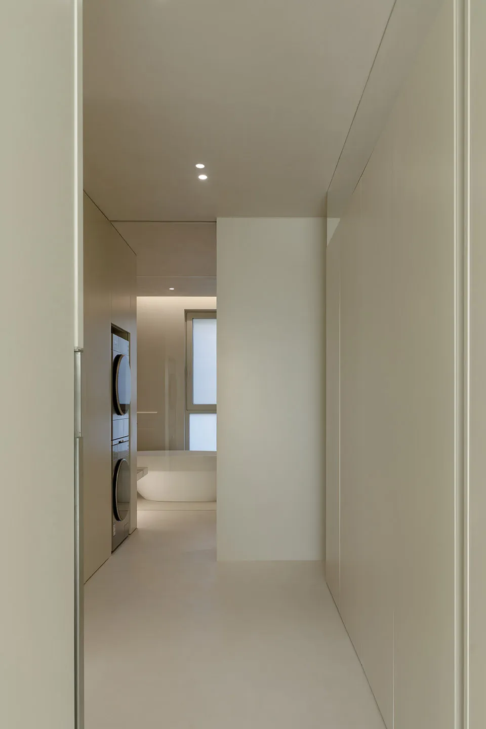 Modern minimalist bathroom featuring neutral colors and clean lines.