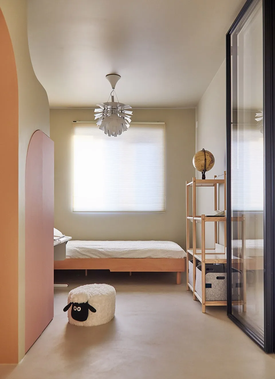 A minimalist bedroom with wooden furniture, a comfortable bed, and a cozy atmosphere.