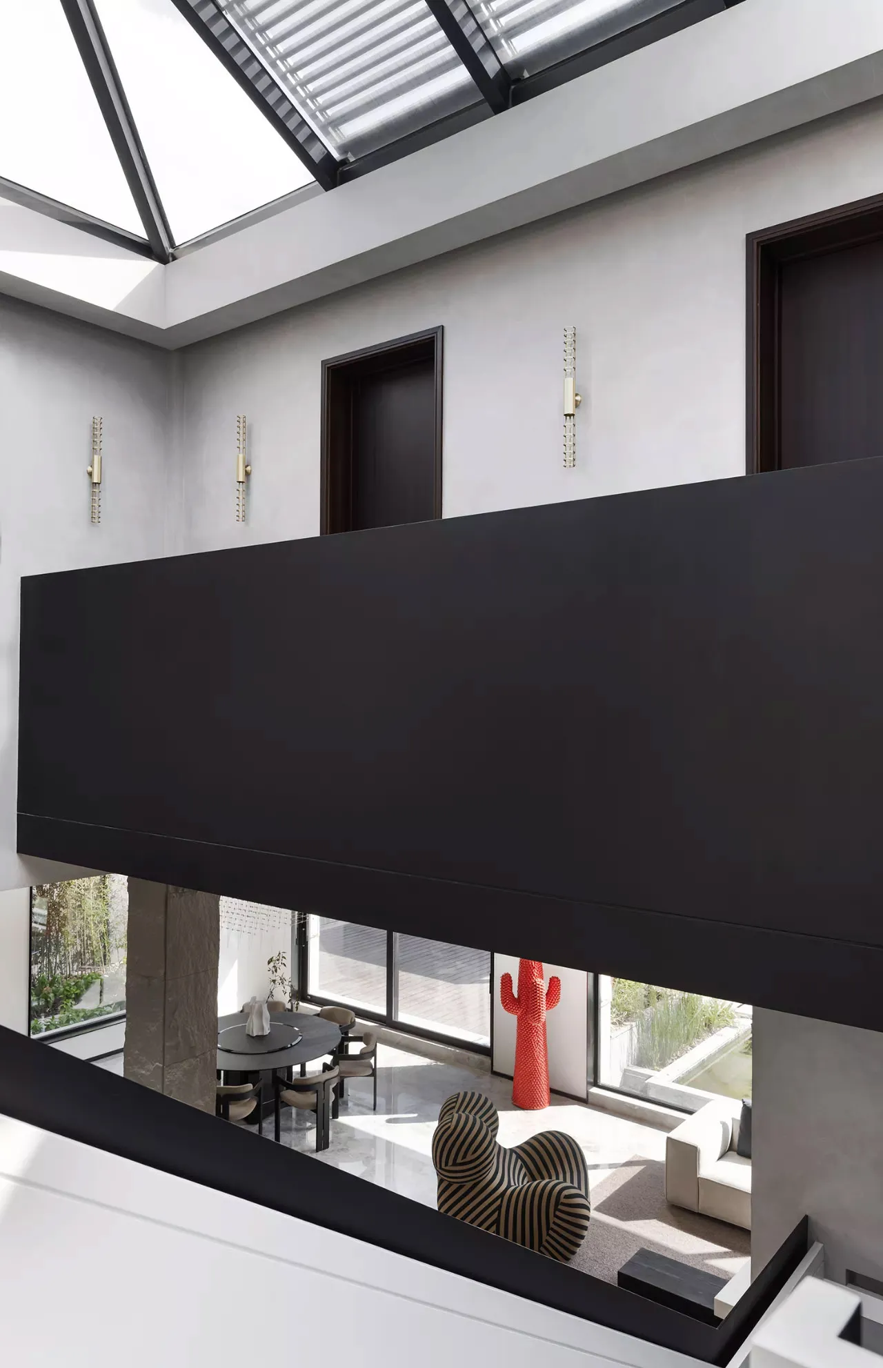 A modern interior design featuring black and white decor with concrete elements