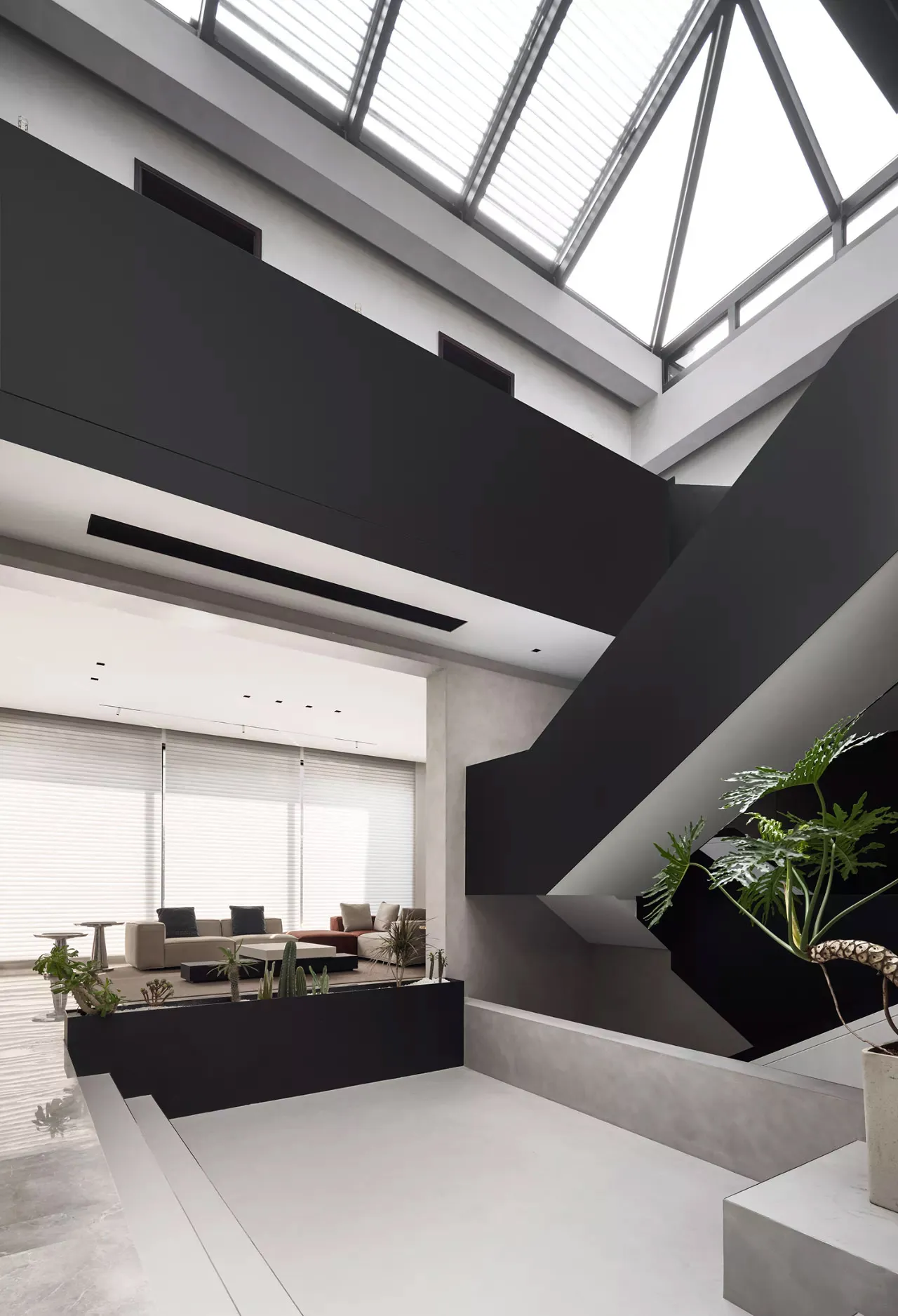 Modern living room with concrete and black accents
