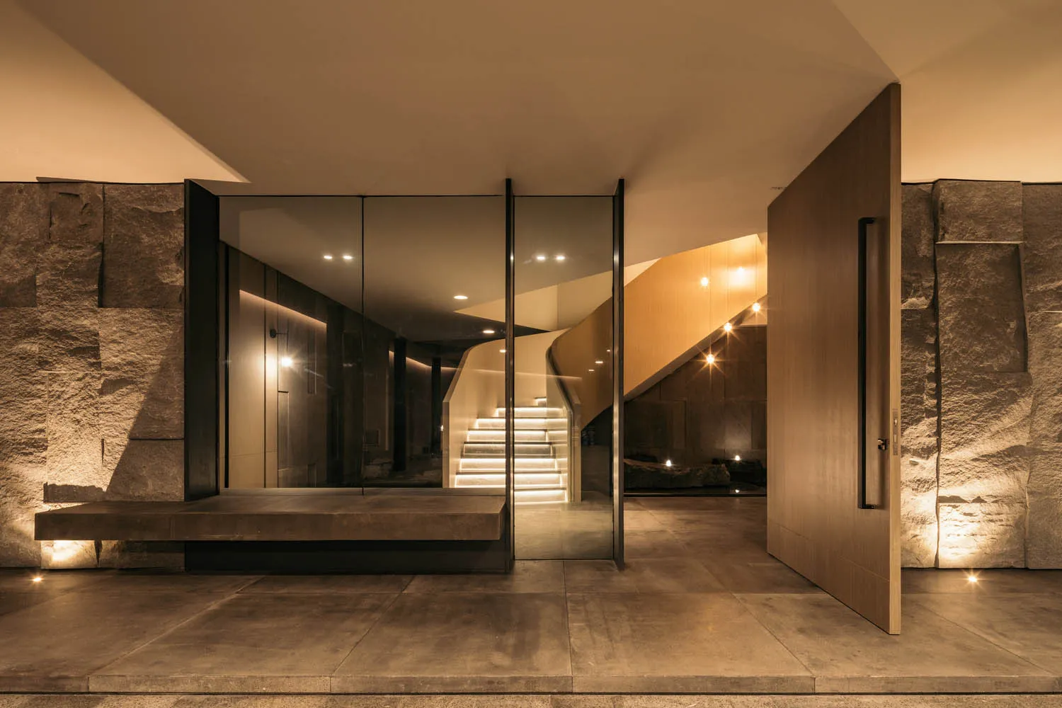 A modern interior space featuring concrete and wood materials.