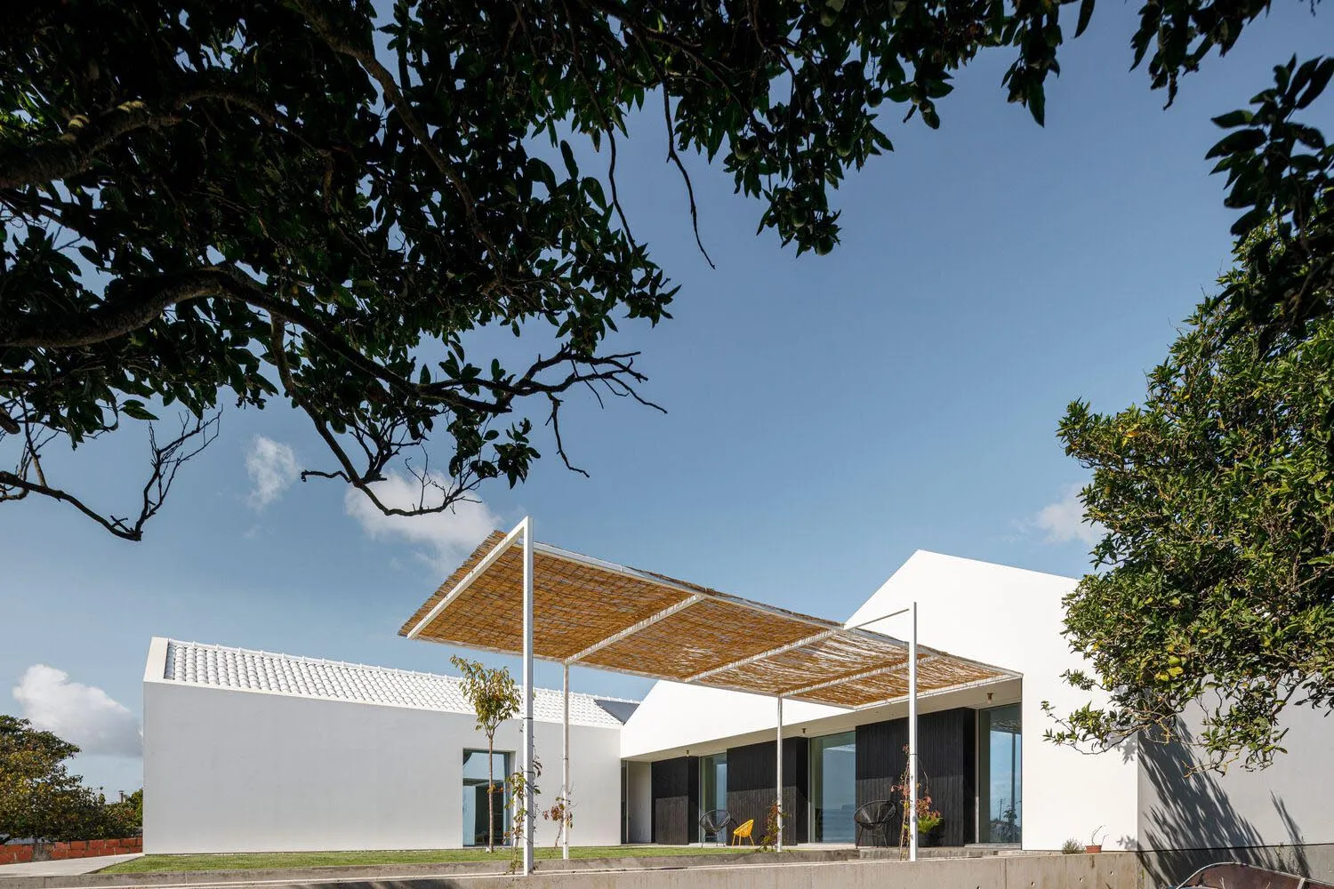 A modern residential building with white exterior.
