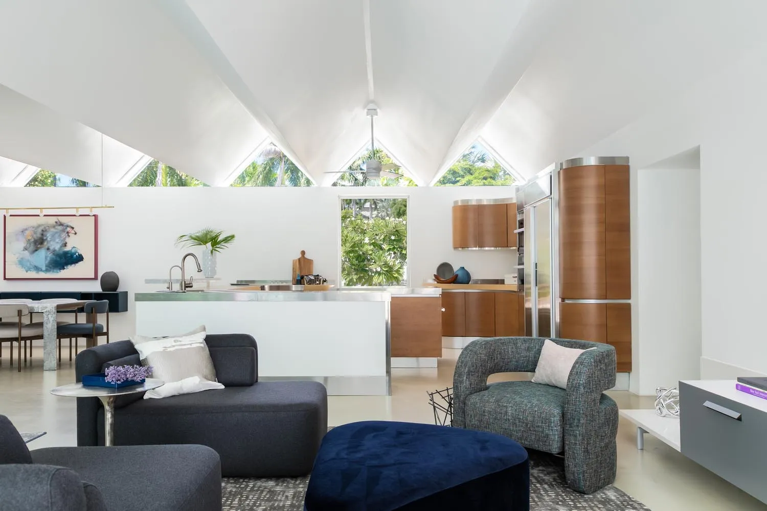 A modern residential living space with a kitchen and living area.