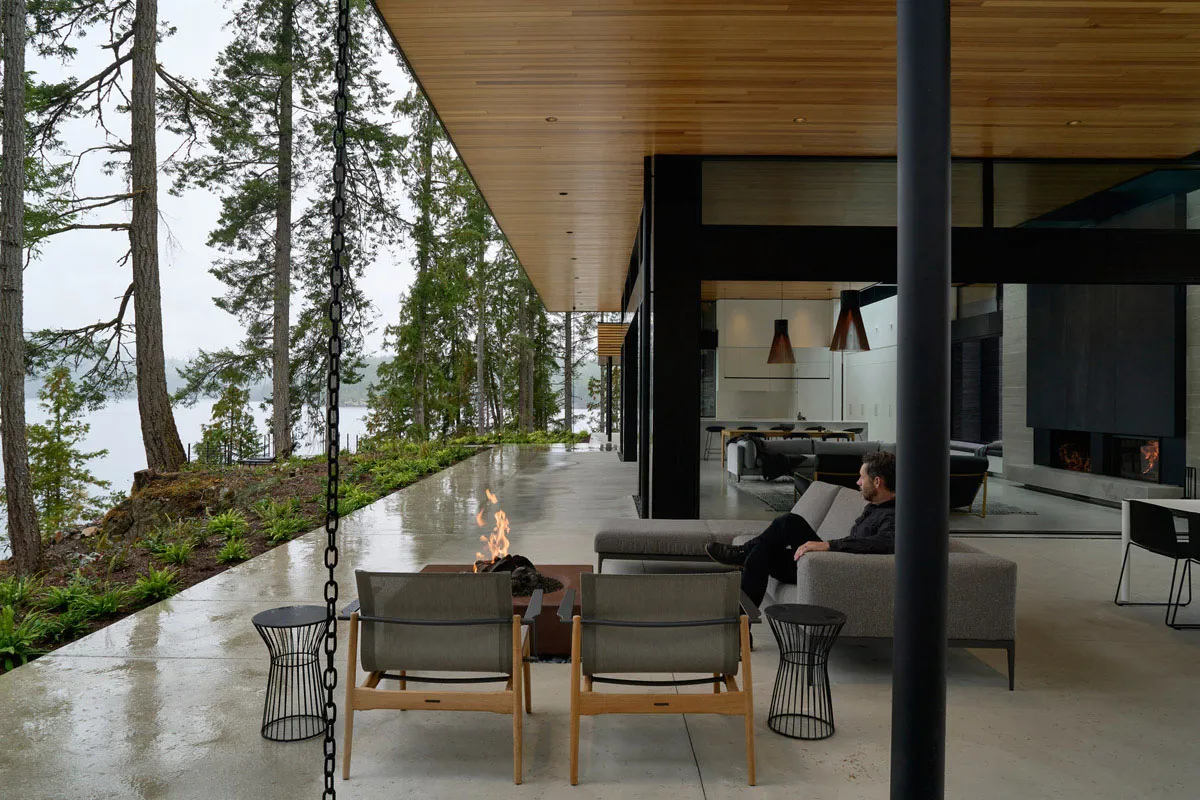 A minimalist living space with concrete and wood elements.