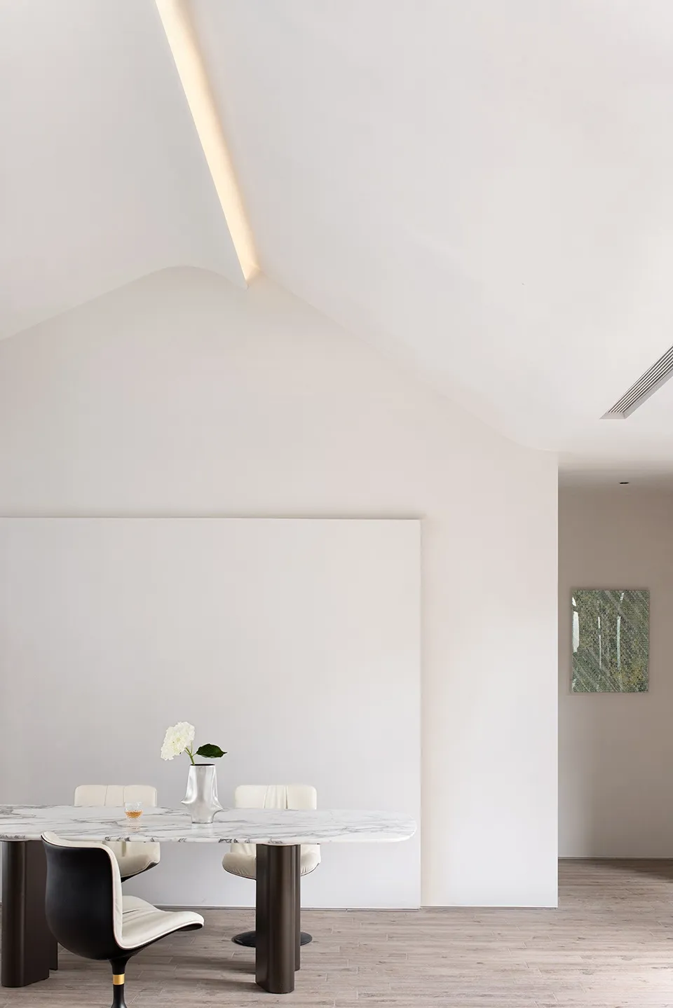 Modern dining room with white marble table and chairs, minimalist design