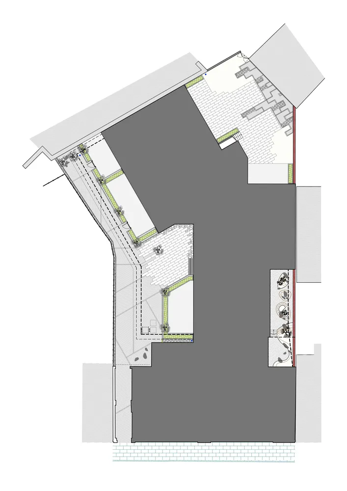 A detailed architectural plan showing a modern building with concrete and tiled flooring.