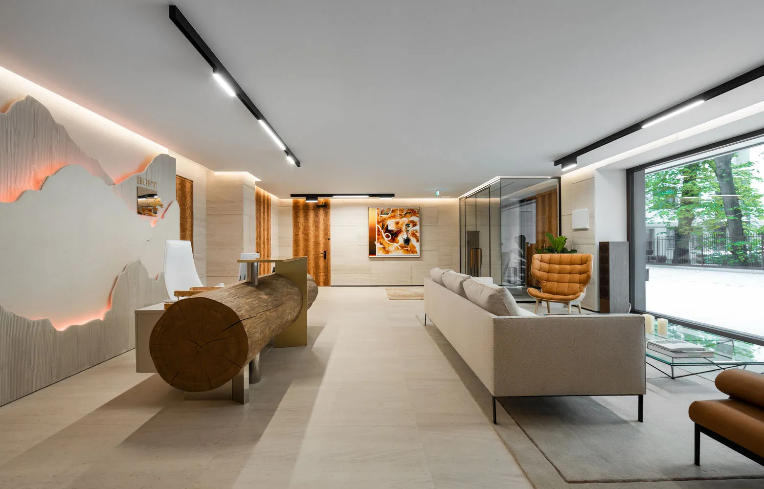 A modern living room featuring a concrete mortar floor and minimalist design.