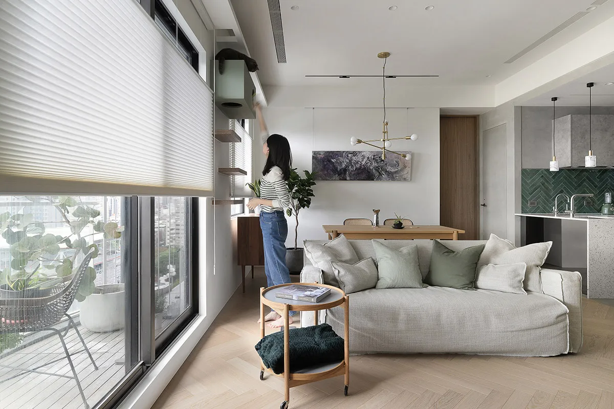 A modern living room with a neutral color palette and minimalistic design features.