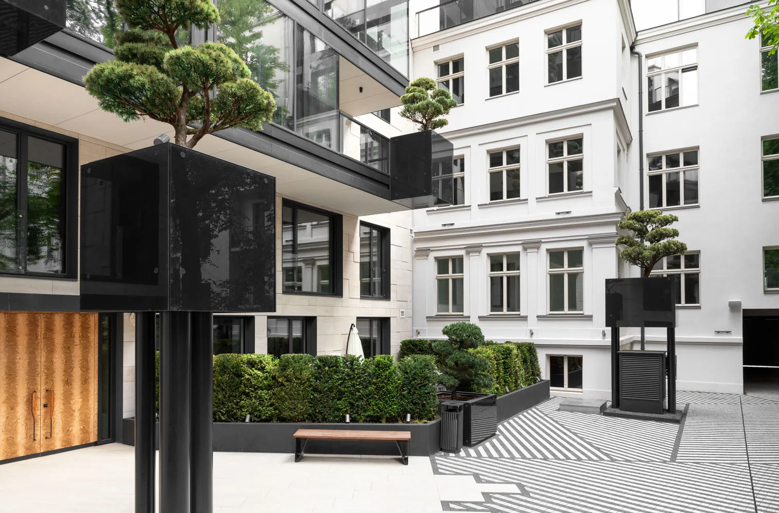 A modern living space featuring concrete and glass materials.