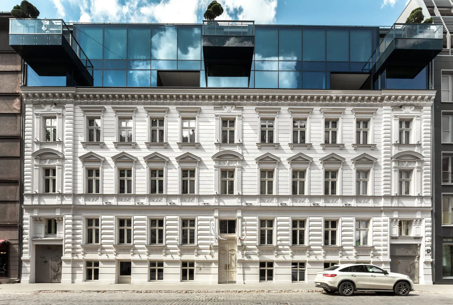 Modern white building with glass addition