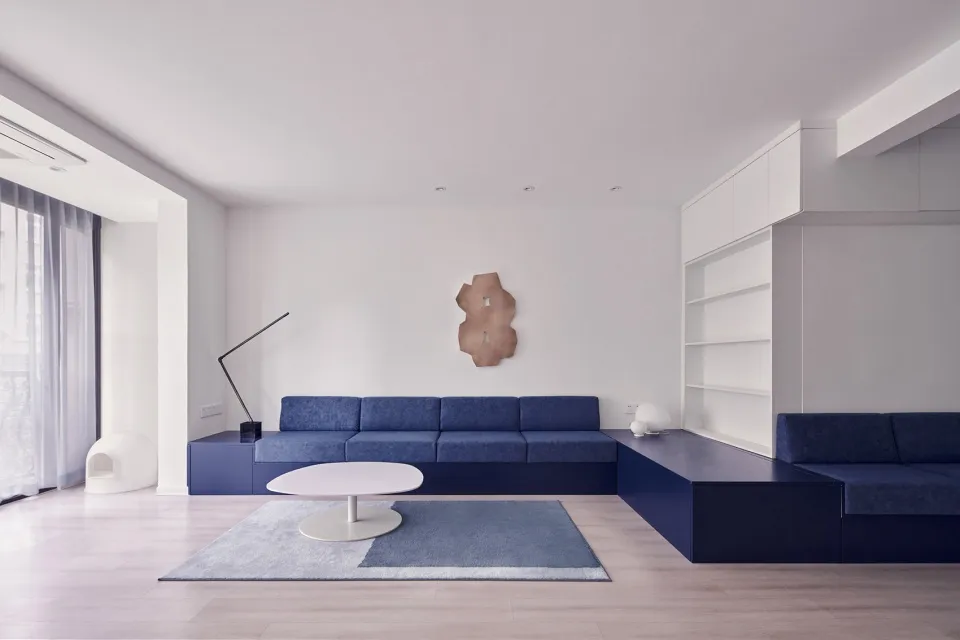 Modern living room with blue furniture on white flooring