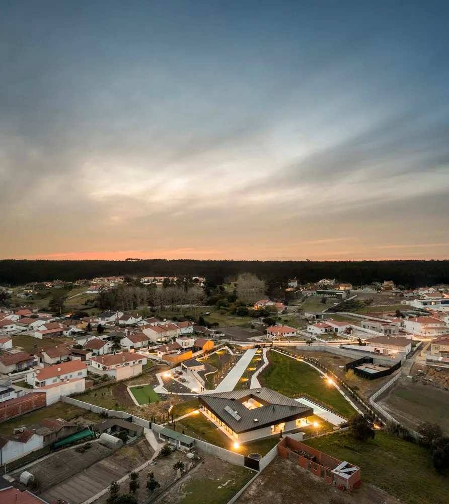 Aerial view of a residential housing development during sunset.