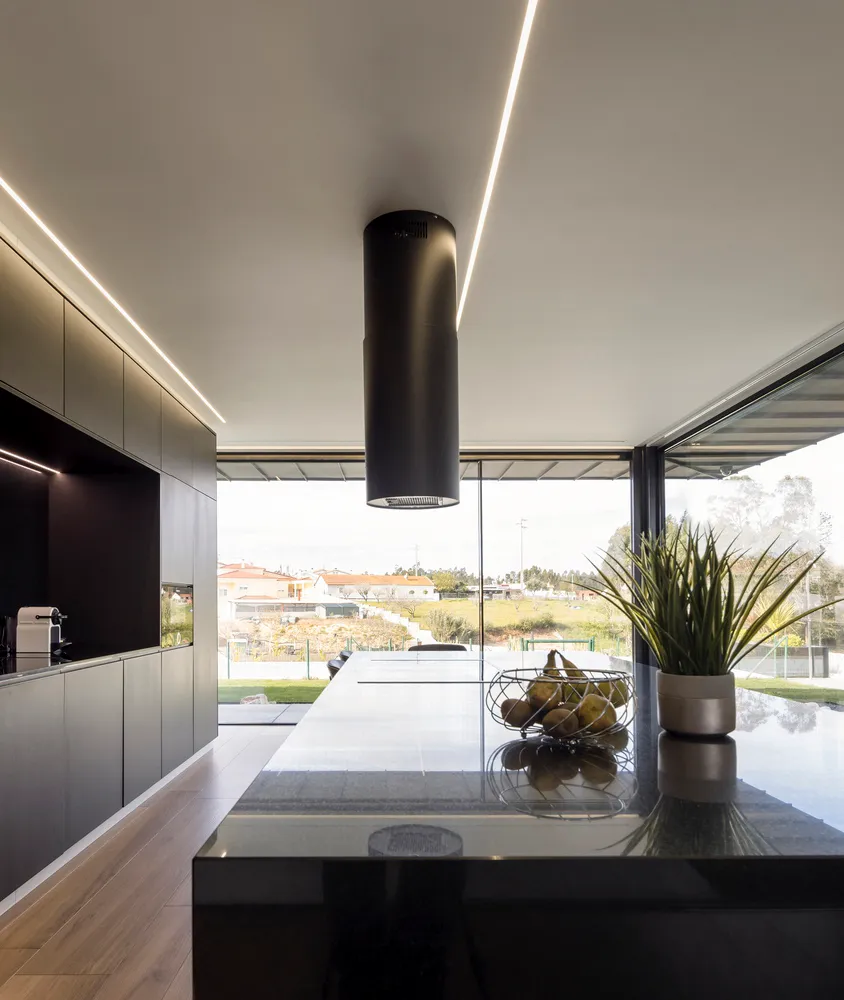Contemporary kitchen interior with black and white design elements.