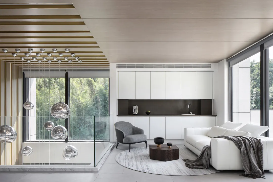 Modern residential interior design featuring concrete and glass materials