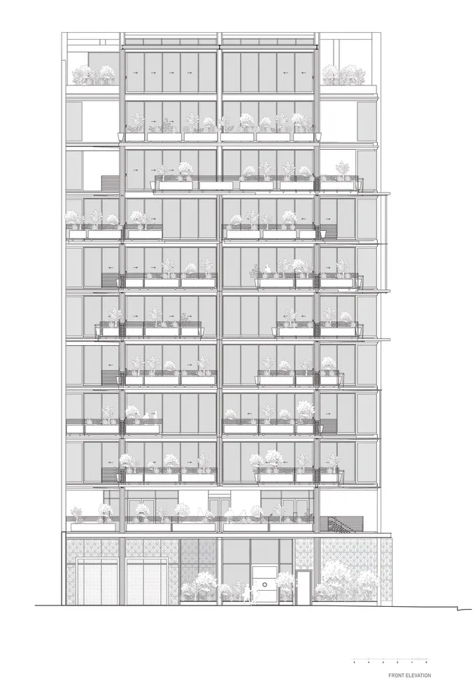Modern residential building with extensive glass facade and green plants on balconies