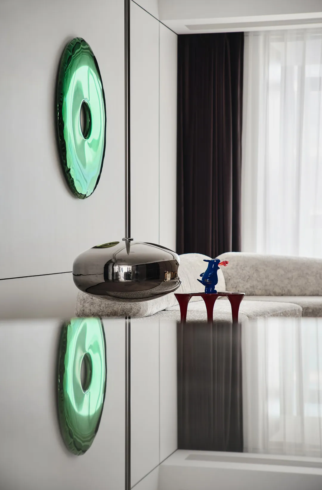 A modern living room featuring white metal ornaments and white furniture.