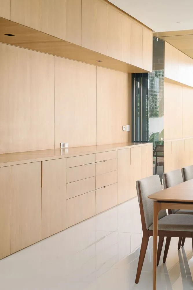 Modern kitchen with wooden cabinets and white flooring