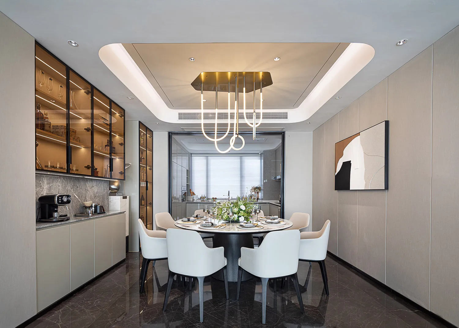 Modern dining room featuring marble and glass furniture.