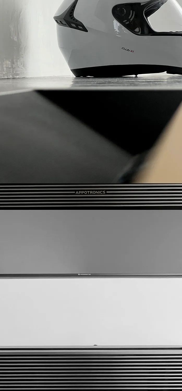 A minimalist electronic device with a black body and a metallic white section.