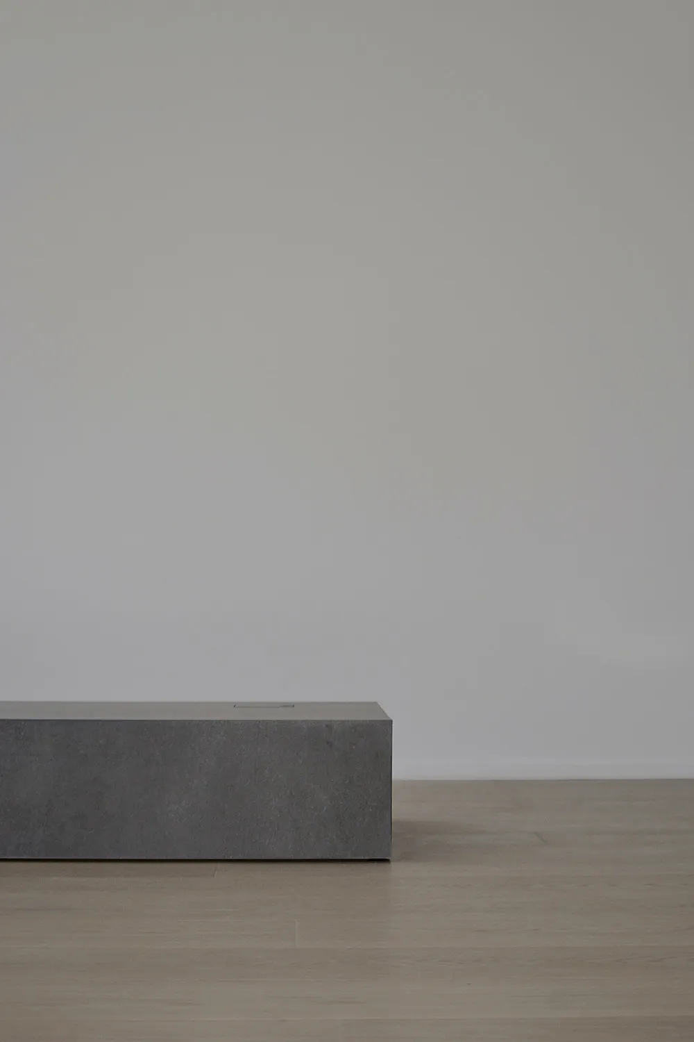 A minimalist furniture piece crafted from concrete.