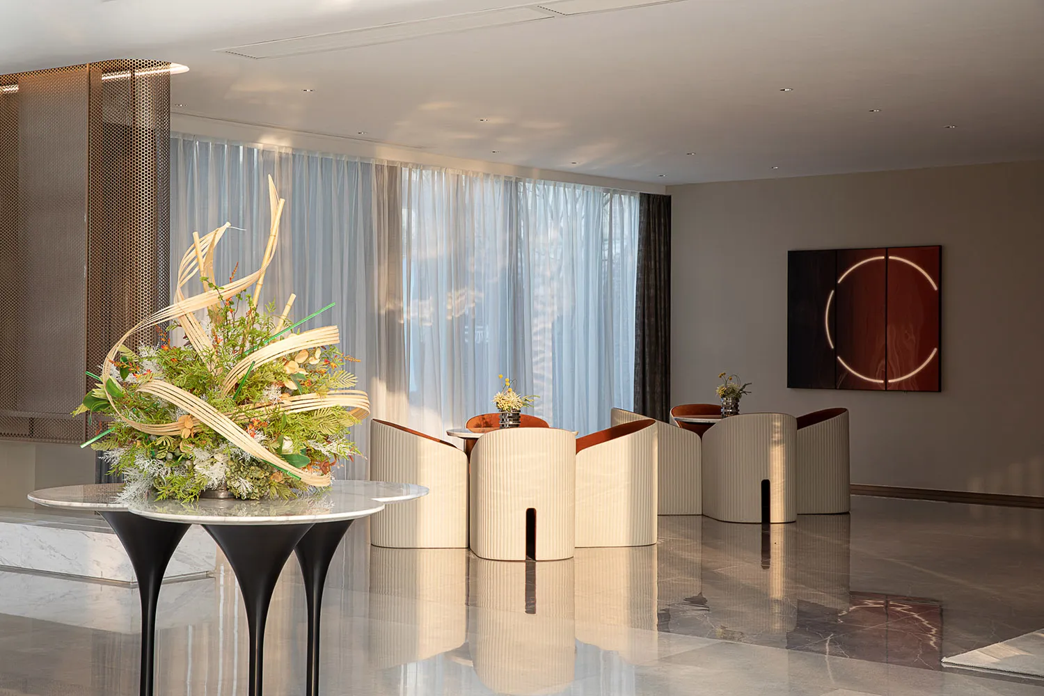 A modern commercial space featuring elegant furniture and artistic decor.