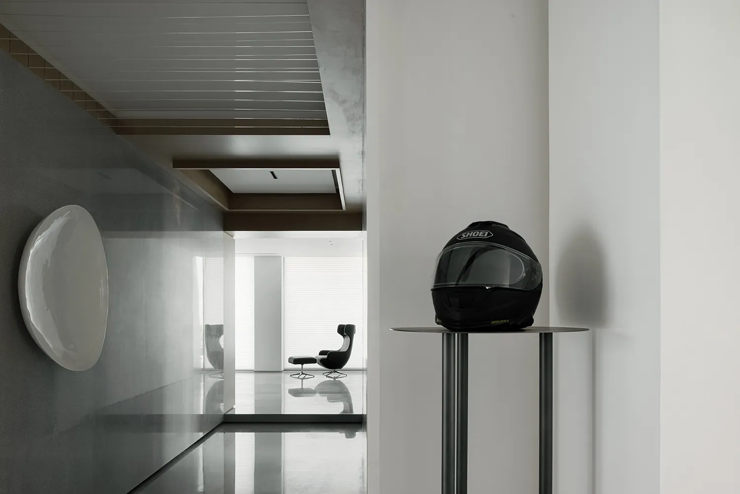 Modern minimalist interior with concrete walls and floor.