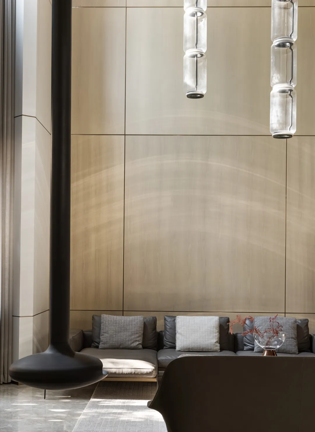Modern, industrial-style lobby featuring metallic furniture and minimalist design.