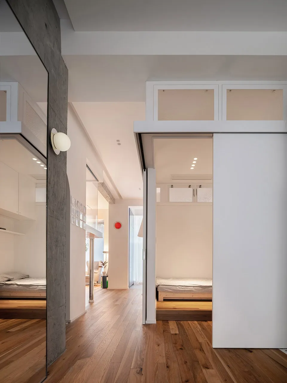 A minimalist residential interior featuring concrete and wooden elements.