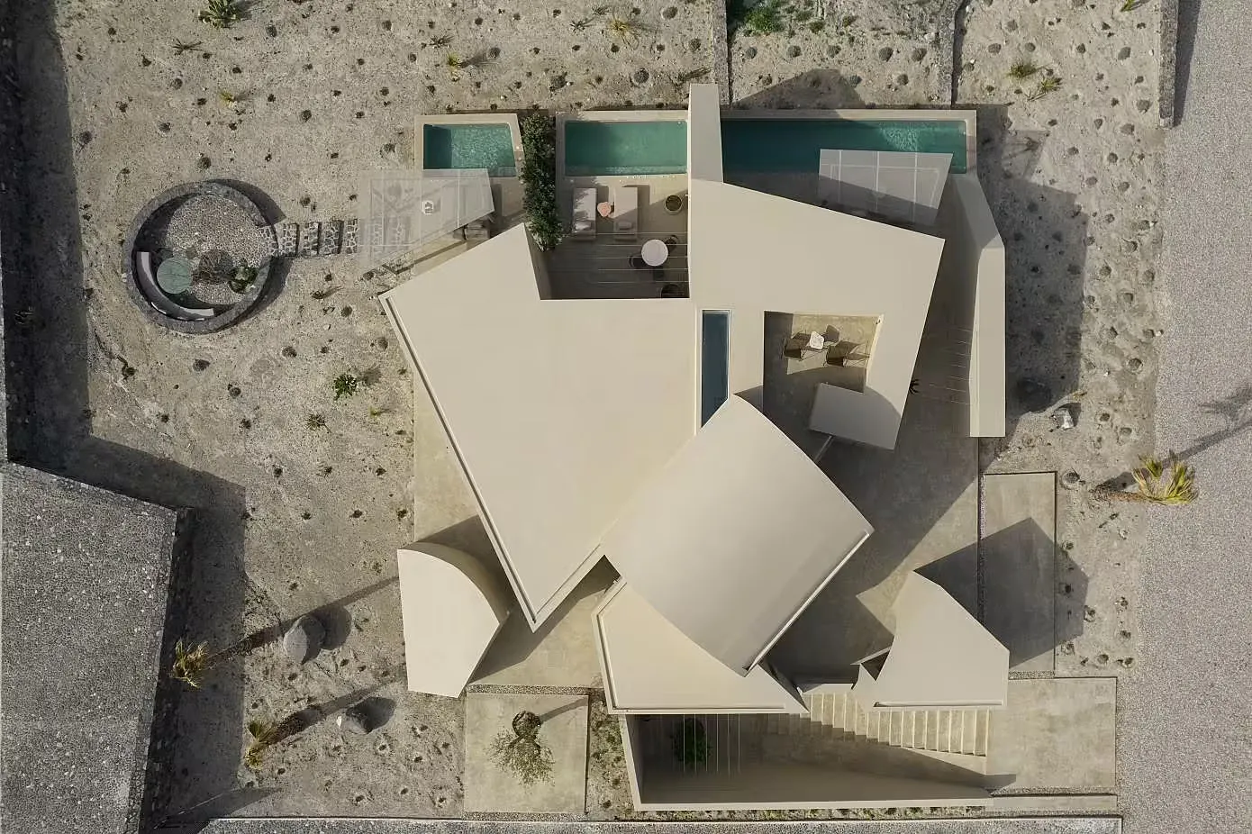 A modern house with a minimalist design, featuring concrete material and a floor plan layout.