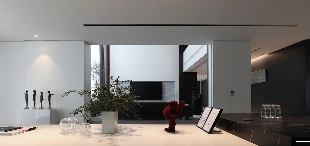 Modern living room featuring glass and marble materials.