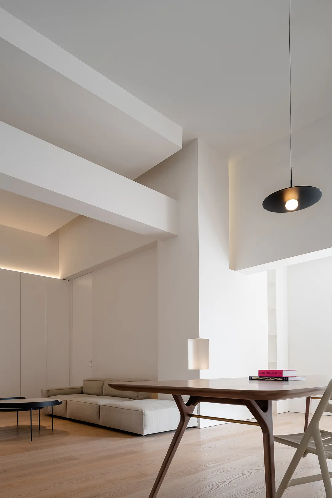 Modern minimalist living room with a sleek, clean aesthetic.