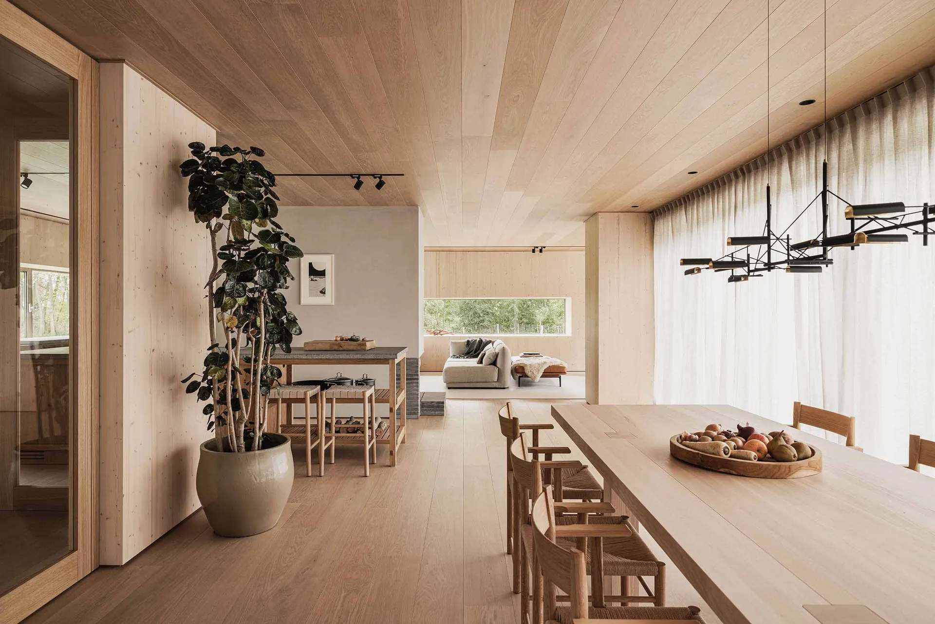 Modern residential interior design with wood materials and a minimalistic approach.
