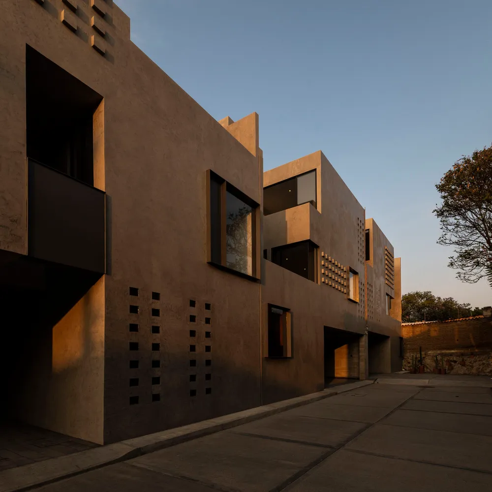 Modern building facade with concrete texture during golden hour