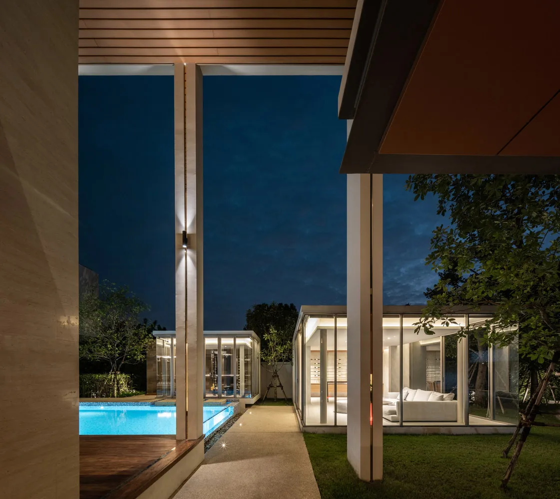 Modern residential exterior showcasing glass walls and a cantilevered design