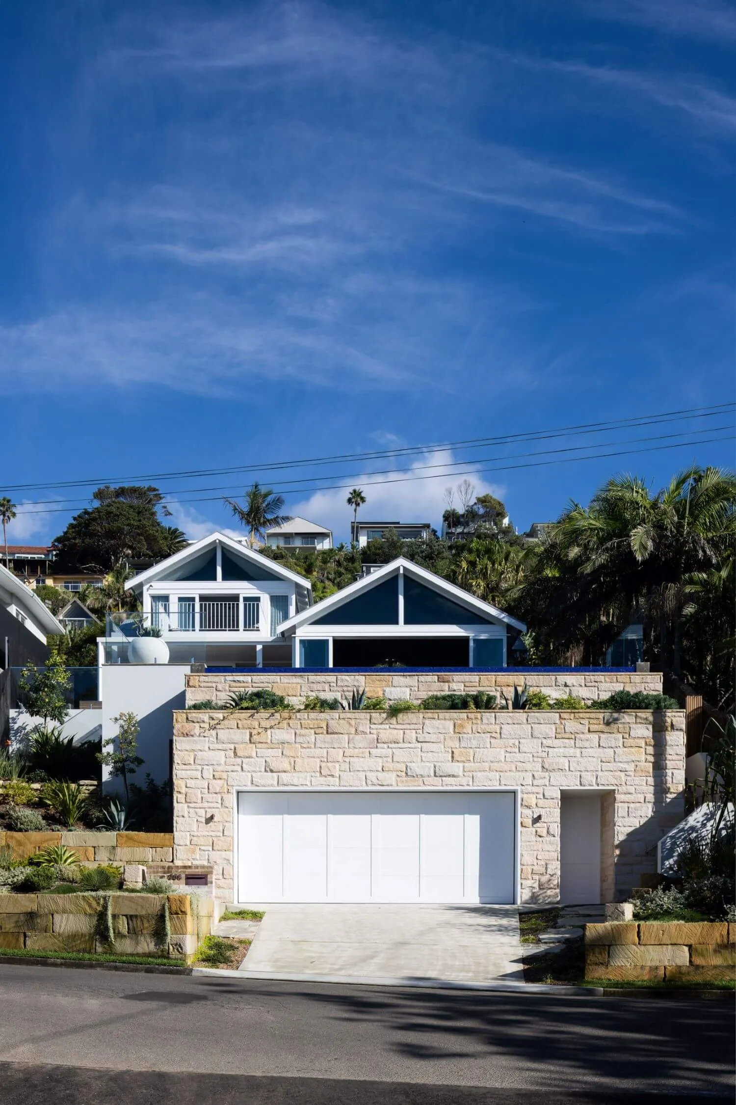 Modern house with stone brick facade and garage.