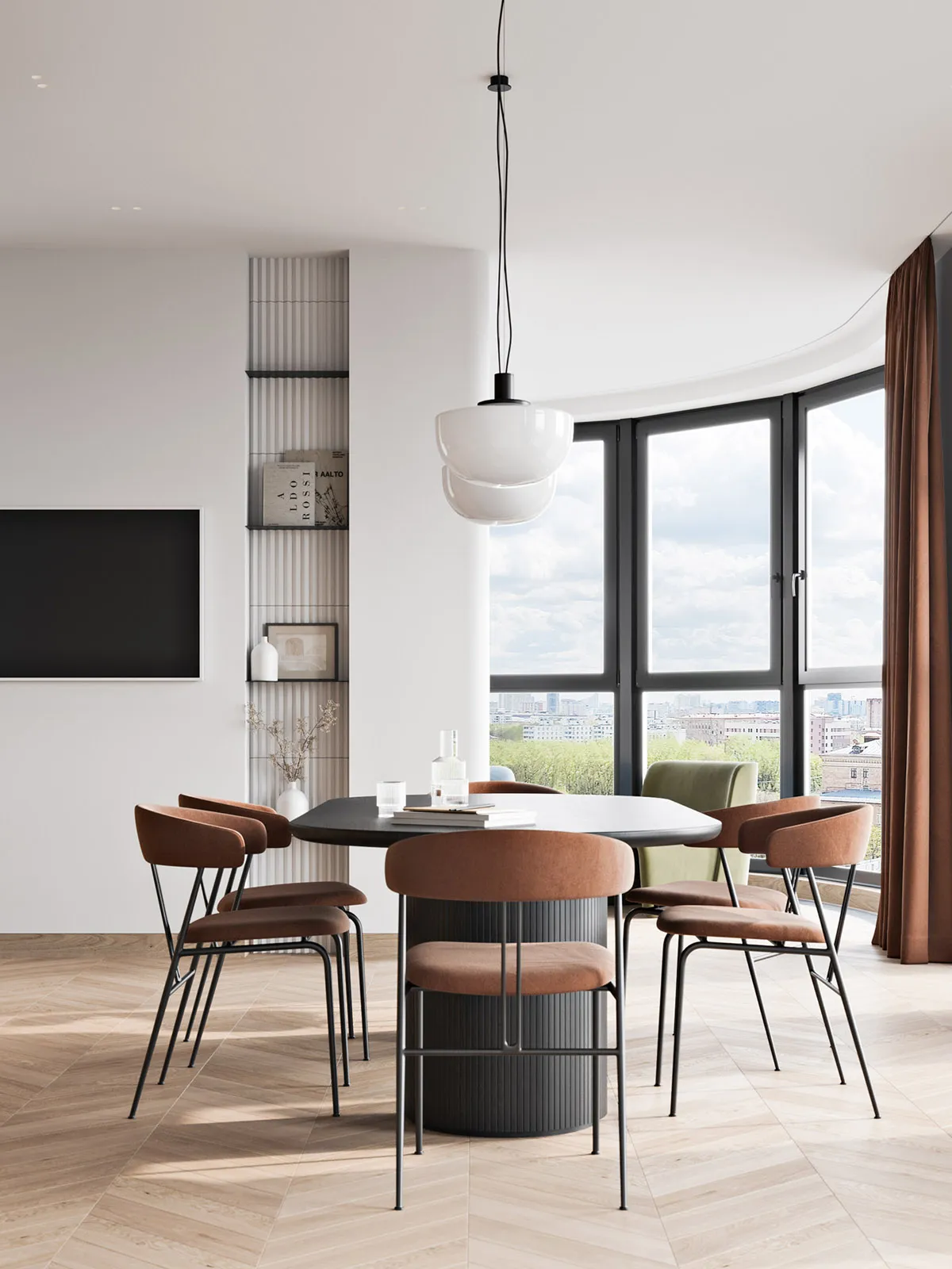 Modern minimalist dining room featuring a round dining table surrounded by copper chairs and a white pendant lamp hanging ove