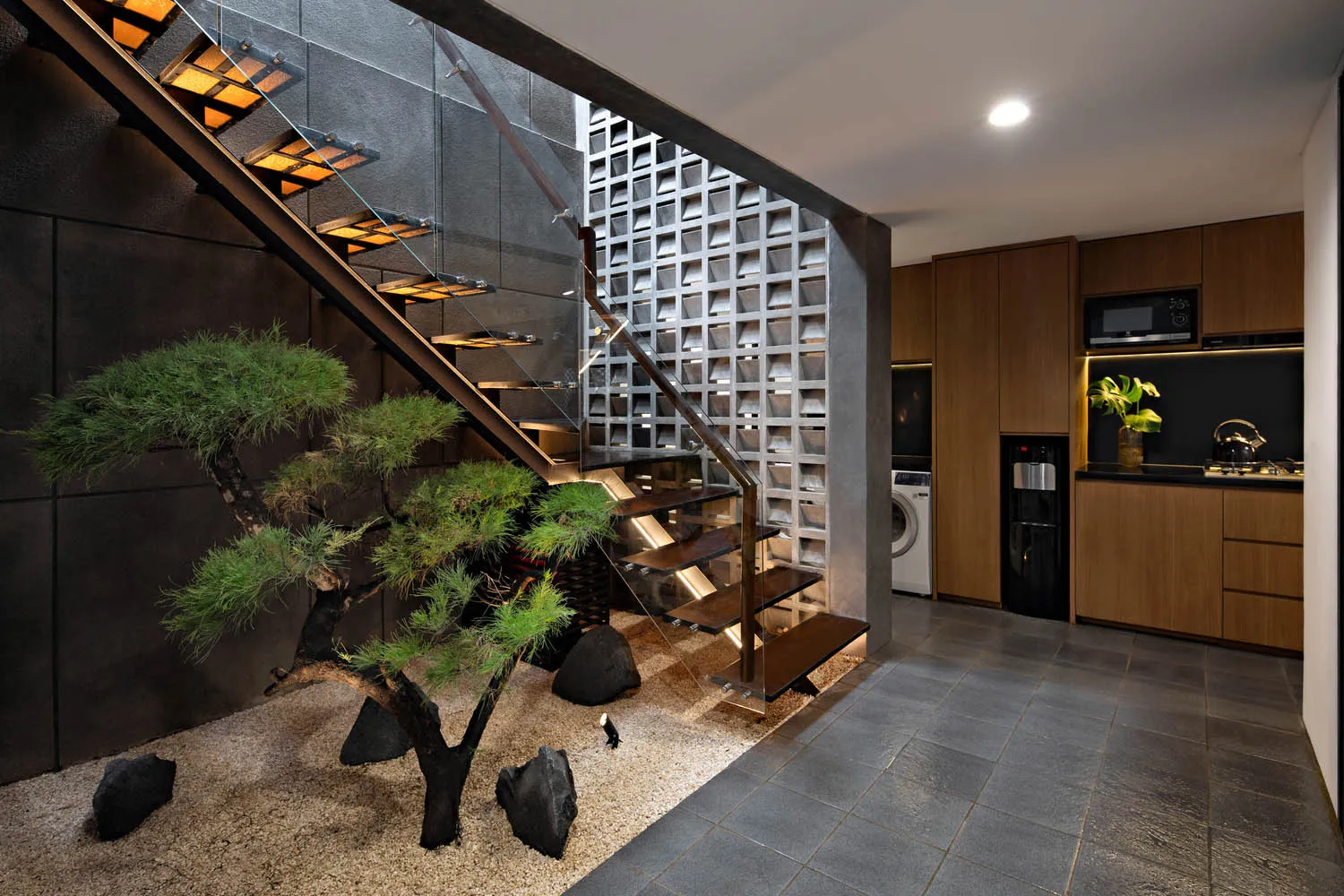 Modern interior design featuring metal, concrete, and glass materials