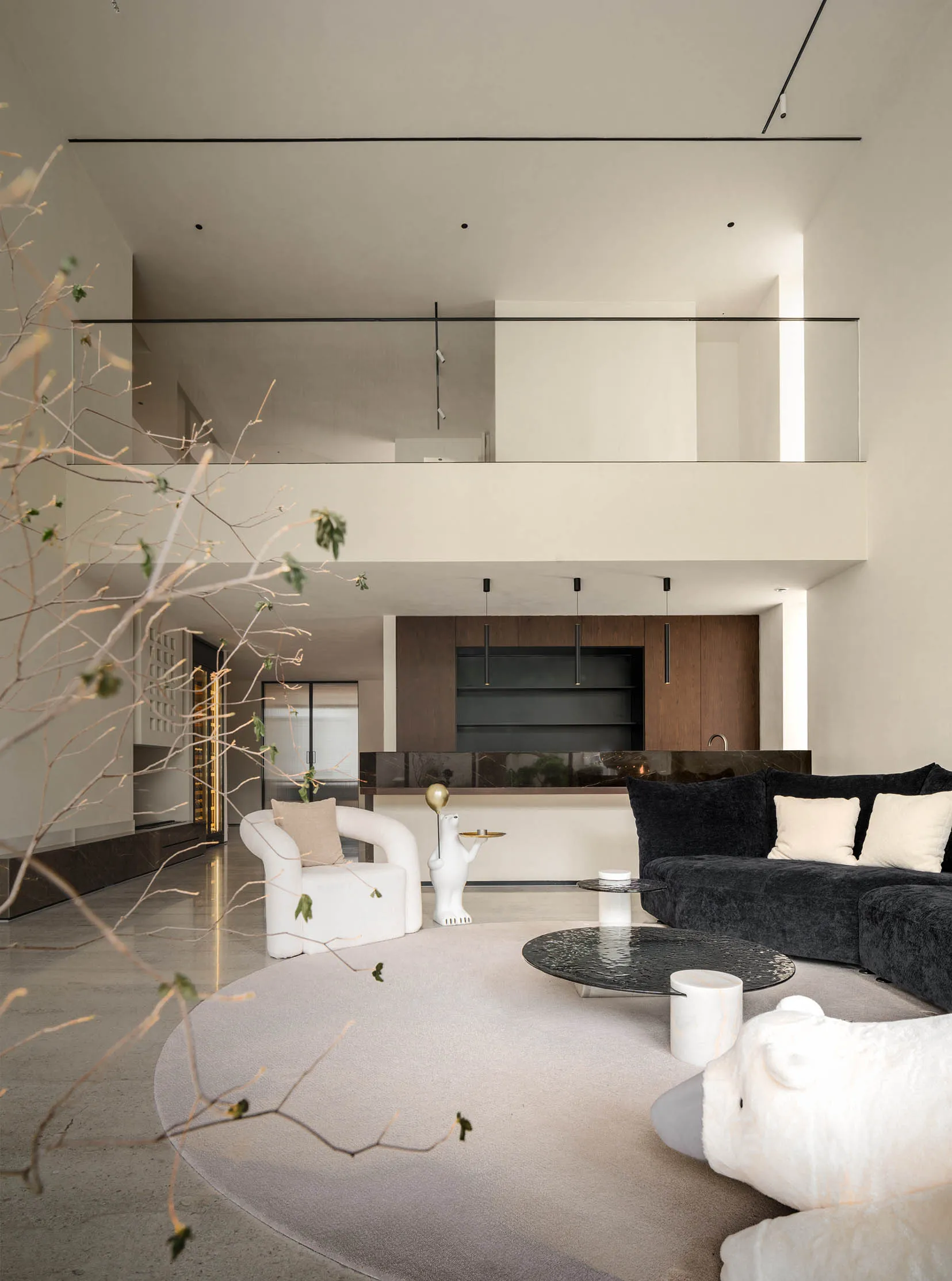 Modern living room featuring a white sofa and black armrests in a contemporary design.