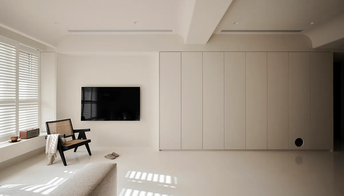 A minimalist living room featuring neutral colors and a sleek, modern design.