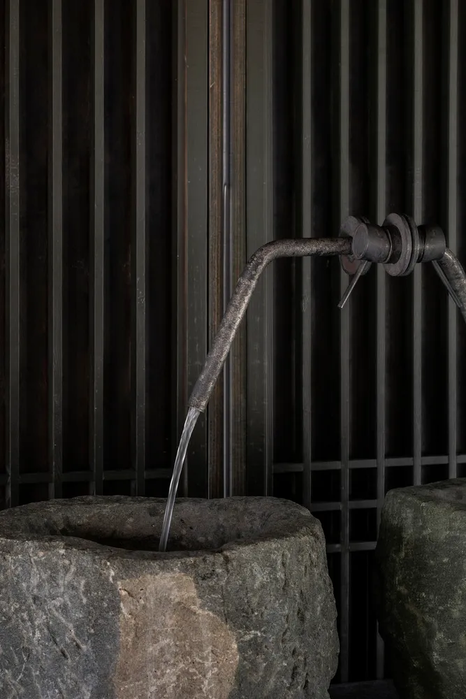A minimalist granite sink, featuring a sleek and modern design.