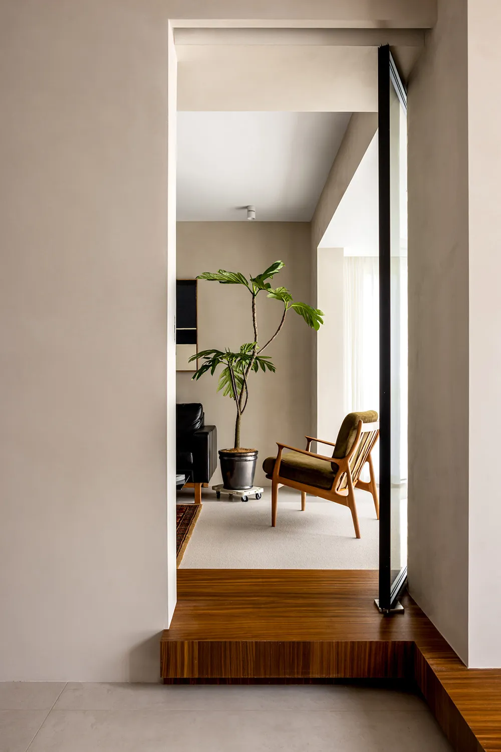 A minimalist living room featuring wooden furniture.