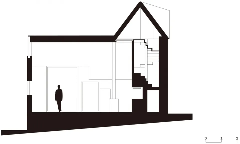 A minimalist interior space with a cross-sectional view showing the layout and design elements.
