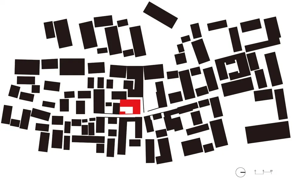 A black and white map of an urban area with a red square marking a specific location.