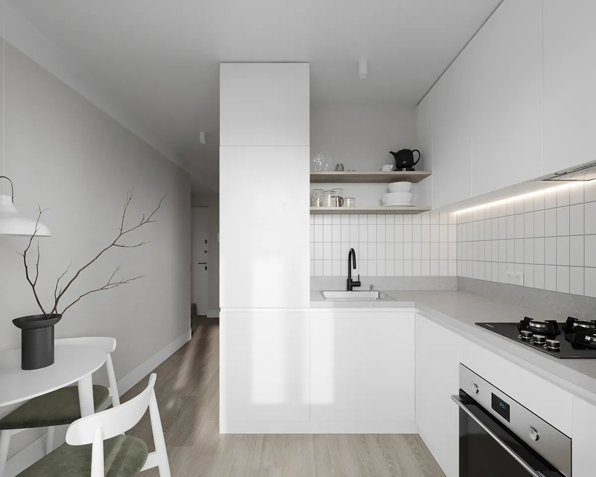 A minimalist kitchen with white cabinets and a modern design.