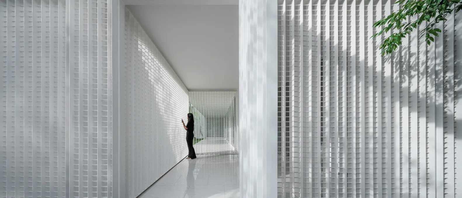 A modern minimalist interior with white metal walls and vertical lines