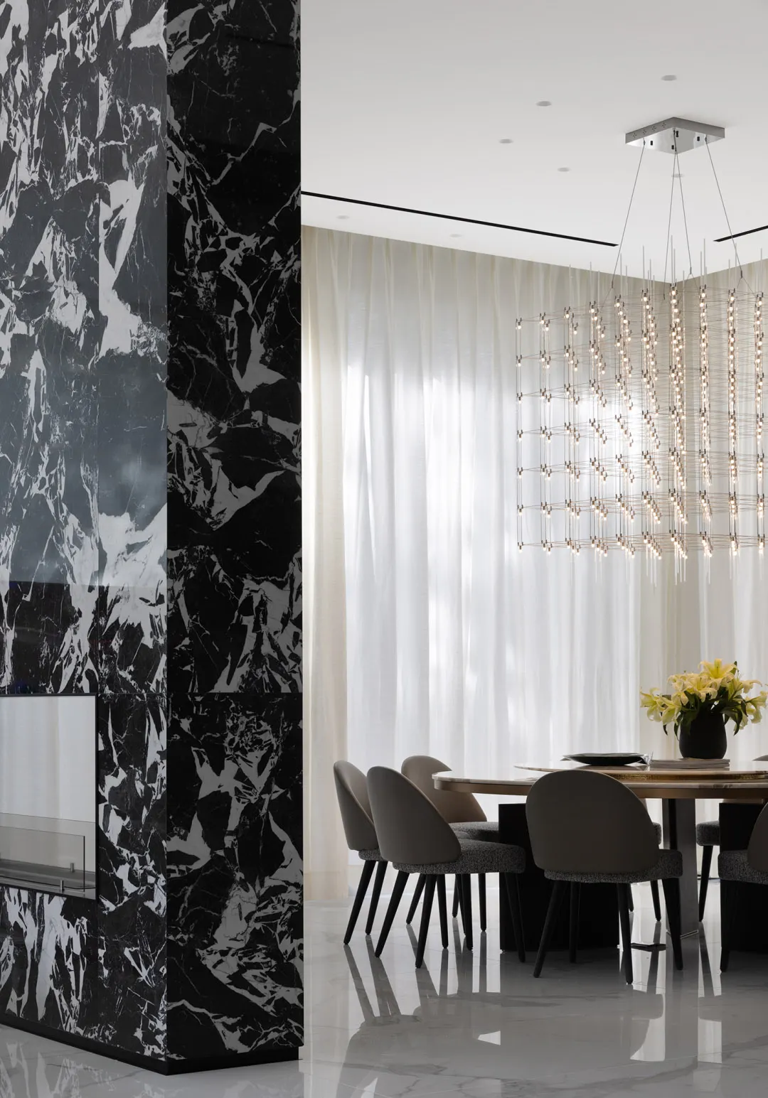 Modern dining room featuring marble accents and contemporary design elements.