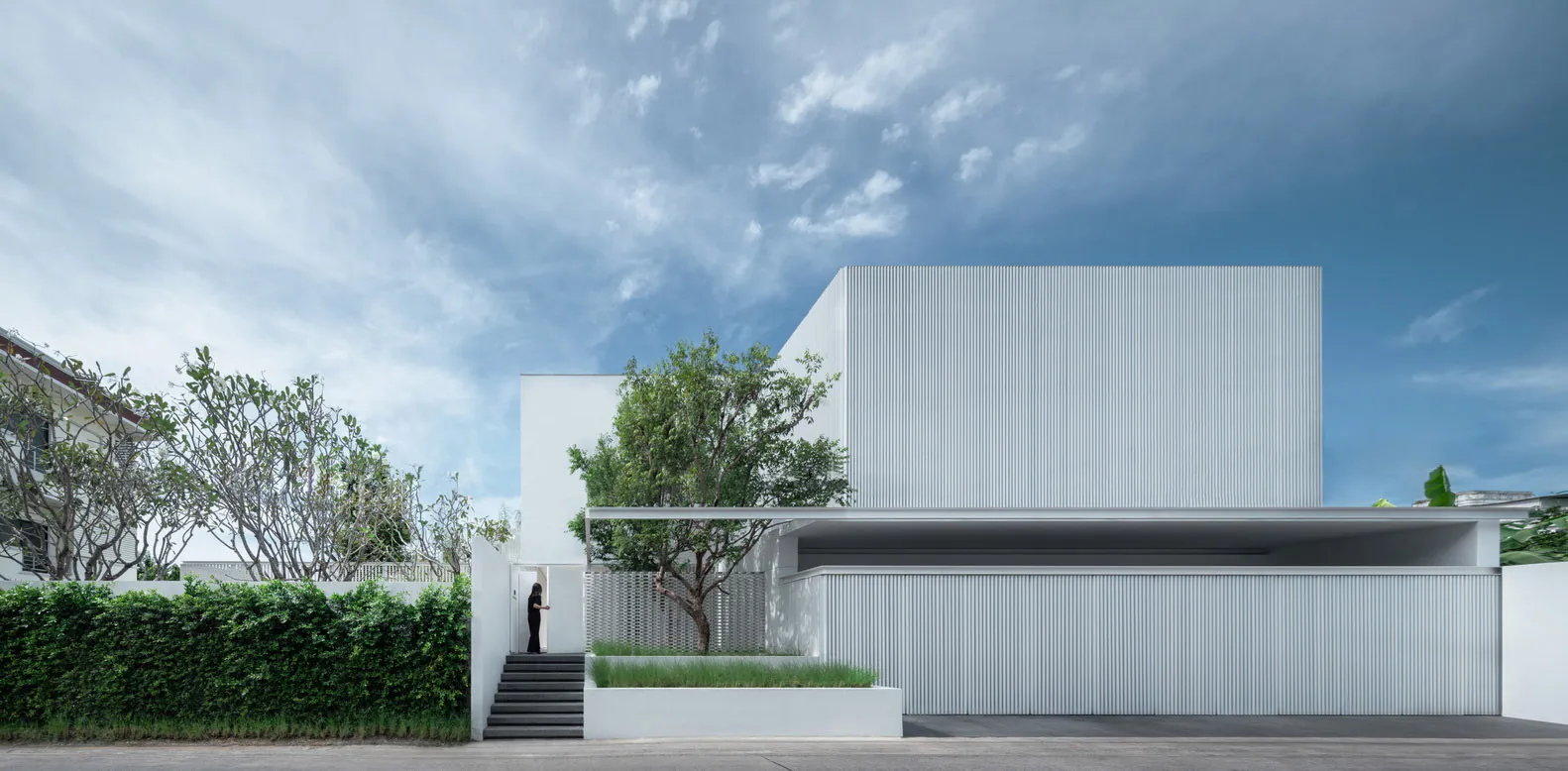 A modern metal house featuring a minimalist design and sleek lines.