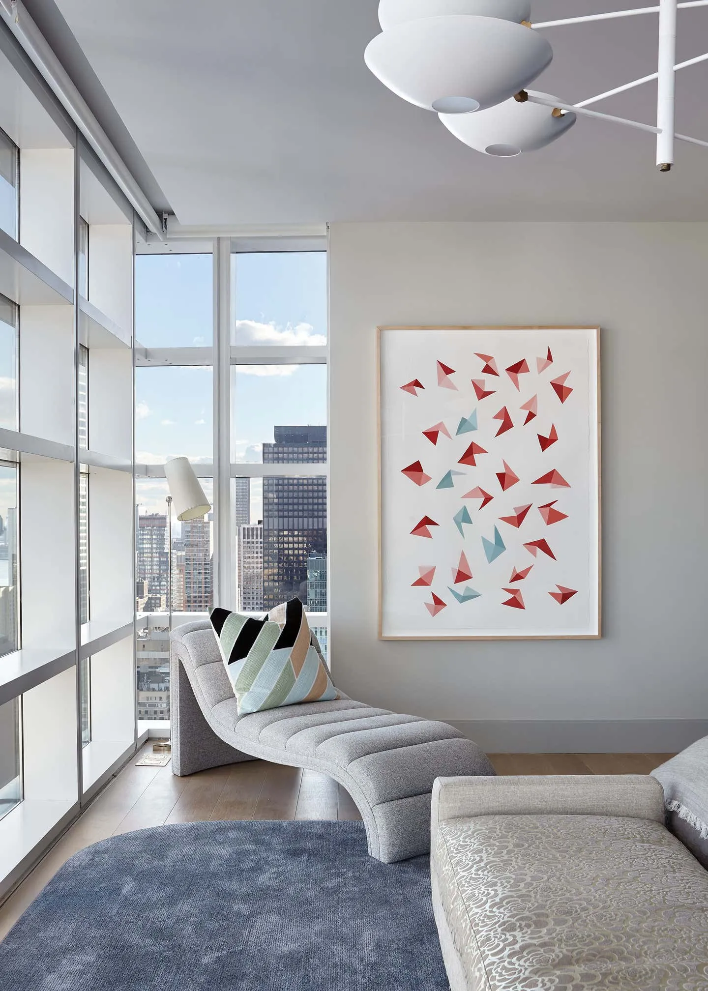 Modern home decor featuring a stylish and comfortable bedroom with fabric and metal elements.
